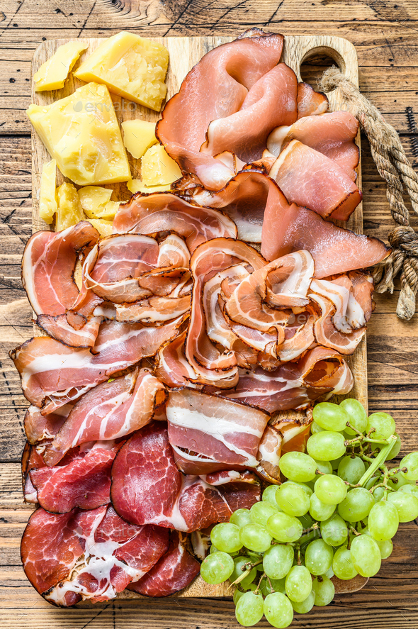 Meat antipasto board, pancetta, salami, sliced ham, sausage, prosciutto