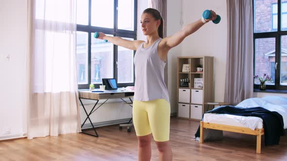 Teenage Girl with Dumbbells Exercising at Home alt