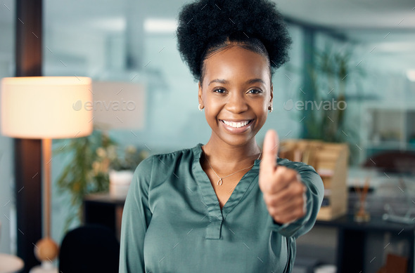 Youre doing so well, keep it up. Portrait of a young businesswoman showing thumbs up in an office.
