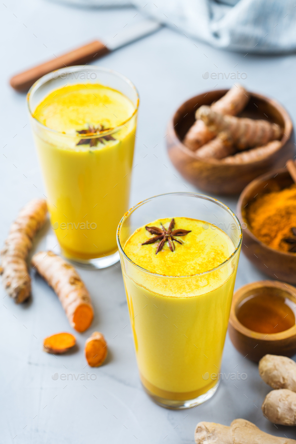 Traditional indian drink turmeric curcuma golden milk with ingredients ...