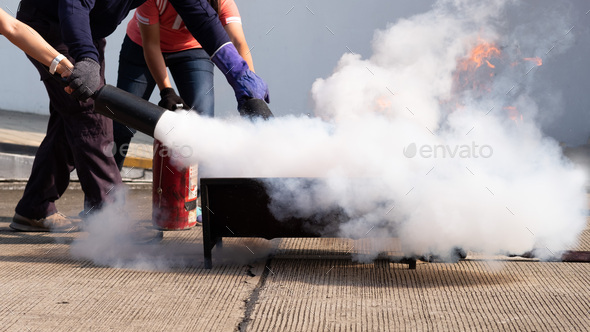 The instructor demonstrate and training the fire extinguisher use, fire evacuation training.