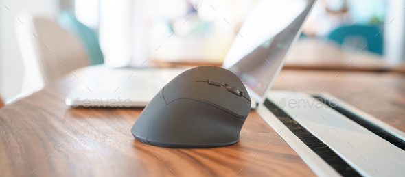 ergonomic mouse on desk at workplace