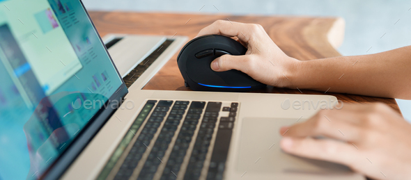 woman hand using computer ergonomic mouse
