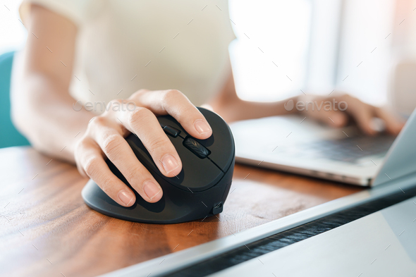 woman hand using computer ergonomic mouse