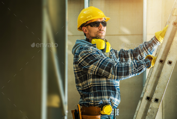 Construction Worker Unfolding a Ladder