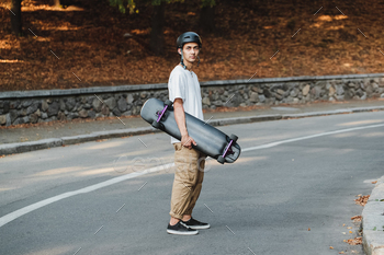 Portrait of a guy with a board in his hands.