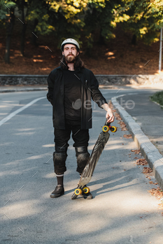 Lifestyle style of sketching, longboard. Portrait of a bearded guy with a board.