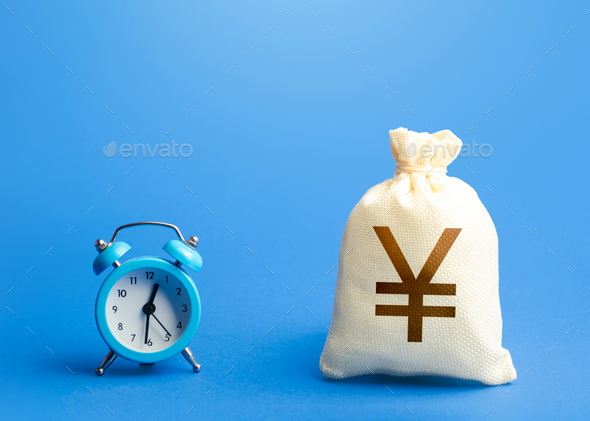Time and chinese yuan or japanese yen money bag. - Stock Photo - Images