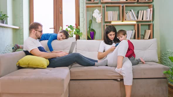 On the Sofa at Home Family Spending Time Together alt