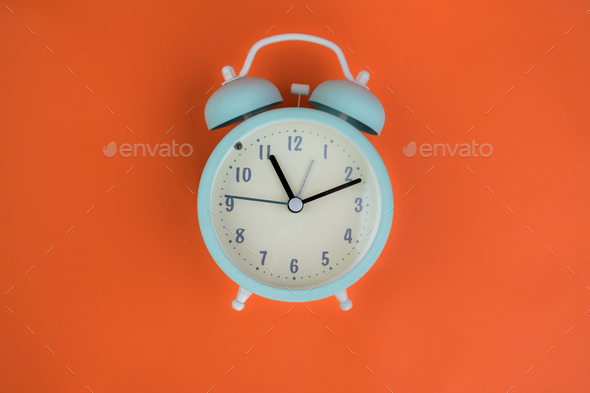 topdown vintage alarm clocks ringing, animation on orange background
