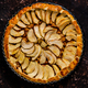 Homemade delicious apple cake with raisins and cinnamon over rusty dark background, top view - PhotoDune Item for Sale