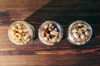 top view of three glass jars with mixed nuts