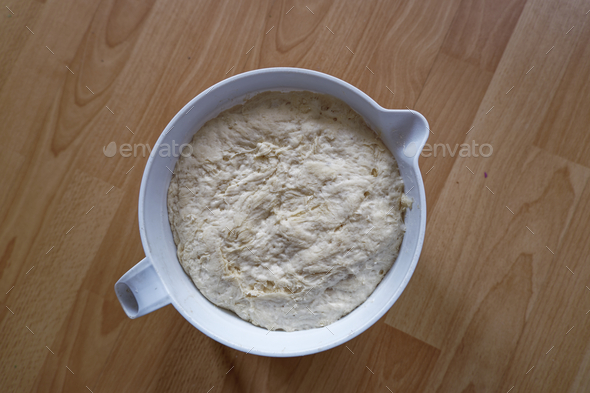 top view of fermented with yeast and risen dough for baking bread