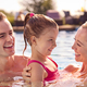 Smiling Family On Summer Holiday Relaxing In Swimming Pool - PhotoDune Item for Sale