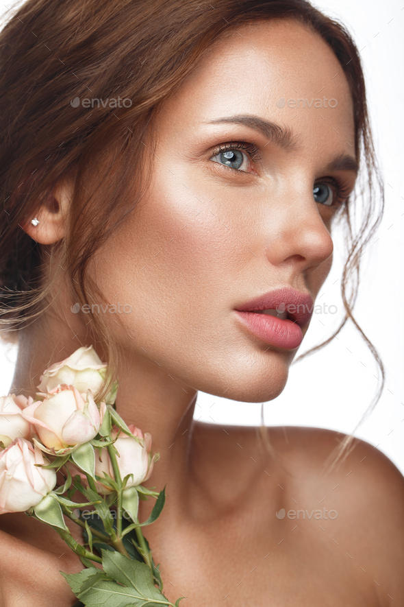 Beautiful Woman With Classic Nude Make Up Light Hairstyle And Flowers