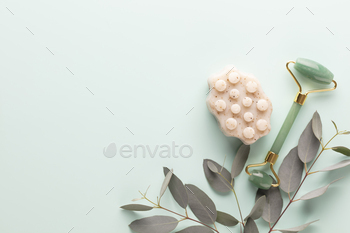 Cellulite soap, eucalyptus  and other spa objects on green background. 