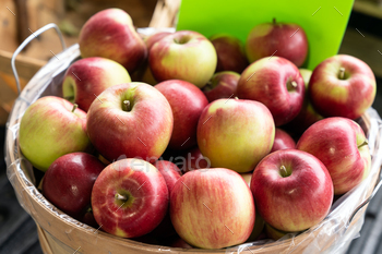 Apples sitting in a wooden basket