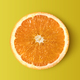 Orange slice isolated on yellow - PhotoDune Item for Sale