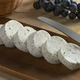 Slices soft Dutch goat cheese with herbs close up - PhotoDune Item for Sale