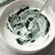 Bowl of yogurt with green spirulina powder close up - PhotoDune Item for Sale