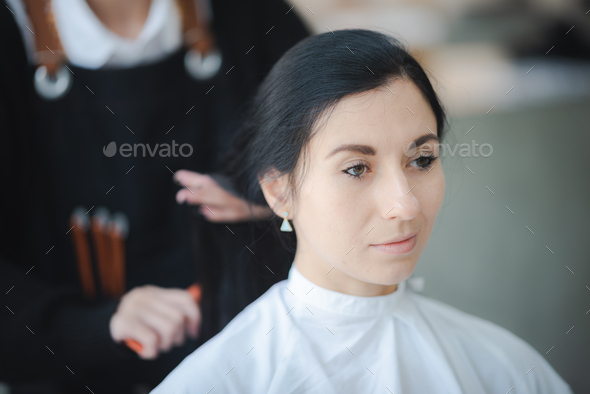 professional fashion hairdresser and hair beauty salon, hairstylist making treatment to client
