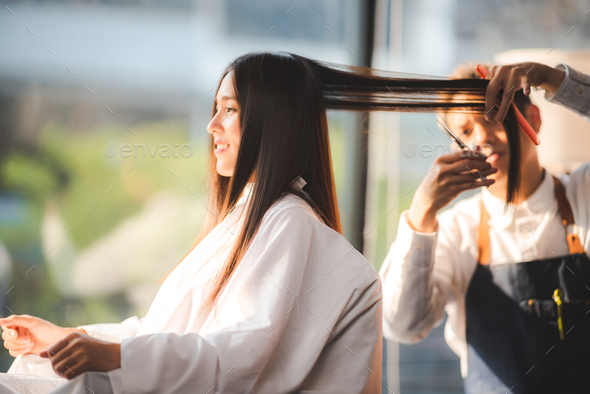 professional fashion hairdresser and hair beauty salon, hairstylist making treatment to woman client
