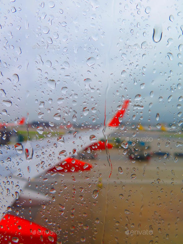 water drops on the airplane window glass, selective focus. selective focus rain drop form window sea