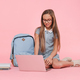 Lessons tutoring online. Happy preteen schoolgirl teenage girl in uniform with bag using laptop - PhotoDune Item for Sale