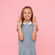 Happy caucasian young preteen teenage schoolgirl in blue dress crossing her fingers for good luck - PhotoDune Item for Sale