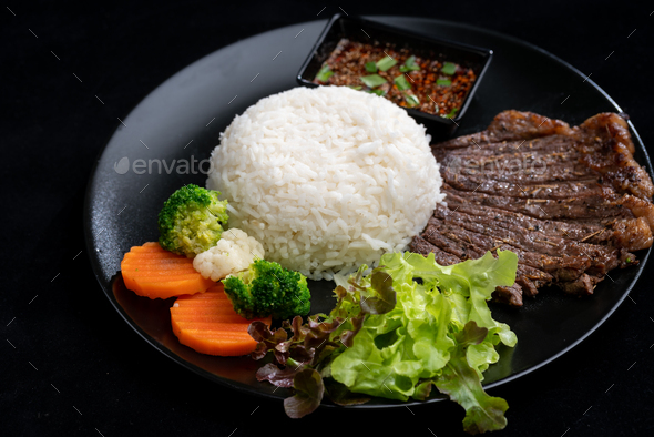 main dish food with grilled beef and rice, serve with vegetable and ...