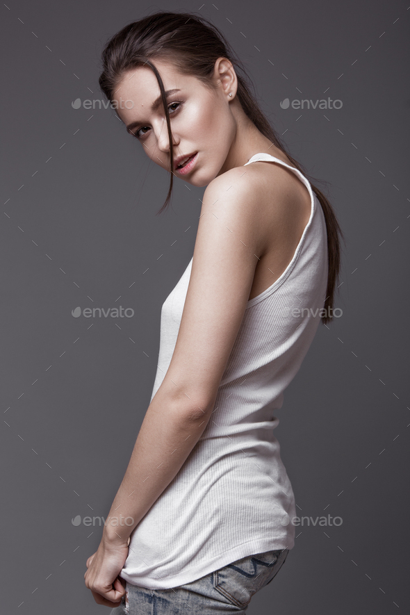 Fashion model with long hair, perfect skin is posing in studio for glamour  test photo shoot showing different poses Stock Photo by ©kobrin-photo  210417014