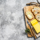 Butter and Baguette  bread for breakfast.  Gray background.Top view. Copy space - PhotoDune Item for Sale