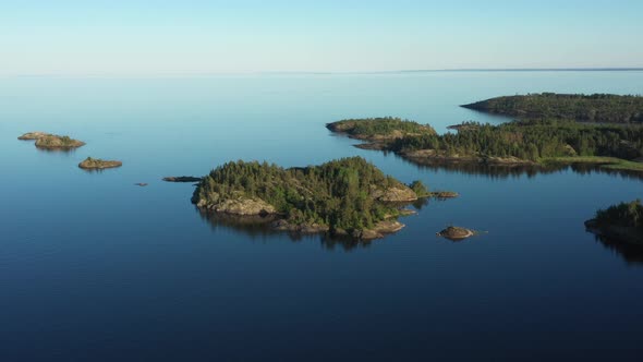 Aerial view on the lake and Islands with rocky coastline and forest in Karelia