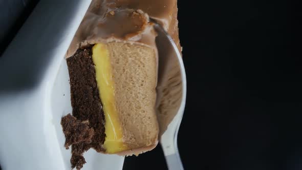 Mousse Cake with Yellow Filling and Biscuit on a Ceramic Substrate