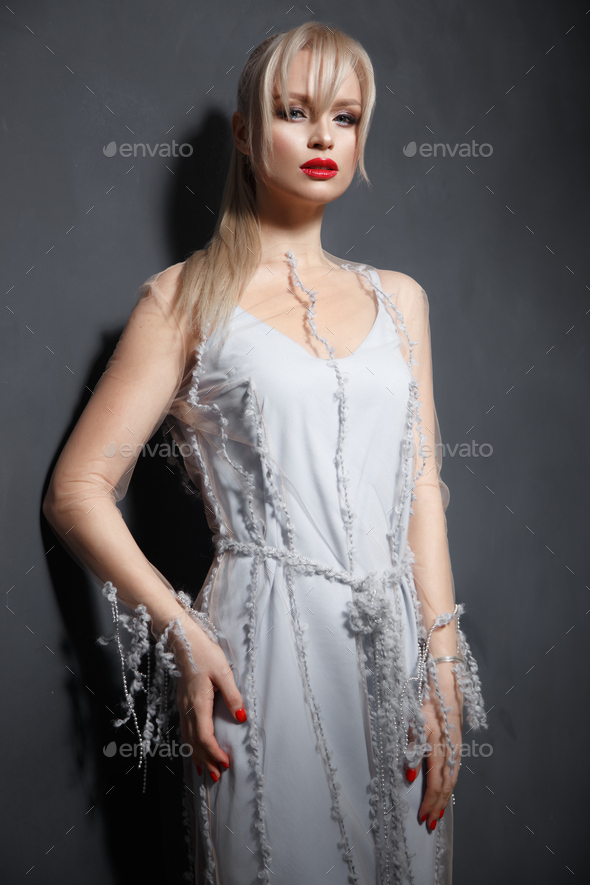 Beautiful Girl In Designer Fashionable Transparent Clothes Posing