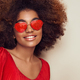 Beautiful portrait of an African girl in sunglasses in the shape of hearts - PhotoDune Item for Sale