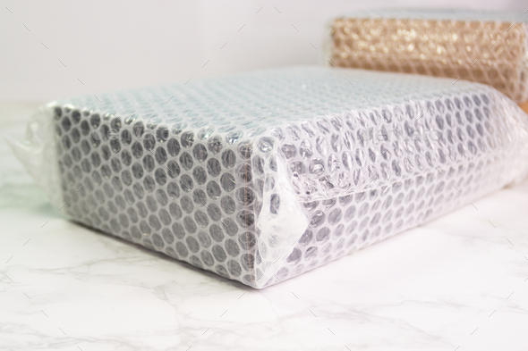 Bubbles covering the box by bubble wrap for protection product