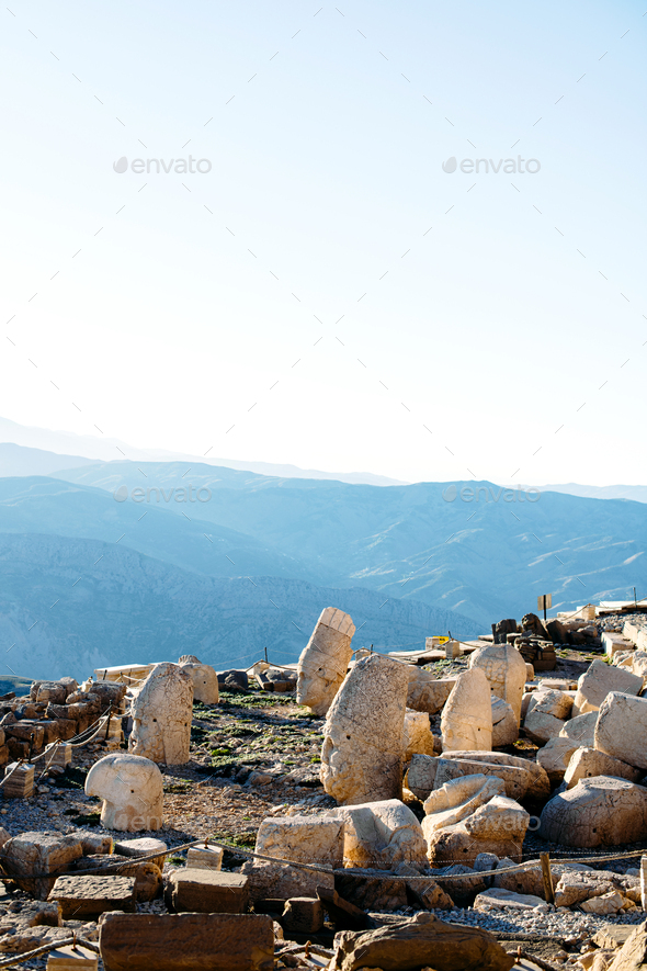 Heads of the statues on Nemrut Dag on the sunset. - Stock Photo - Images