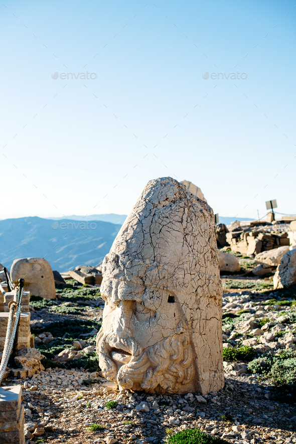 Heads of the statues on Nemrut Dag on the sunset. - Stock Photo - Images
