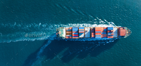 Aerial top view of cargo ship carrying container and running for export goods from cargo yard por