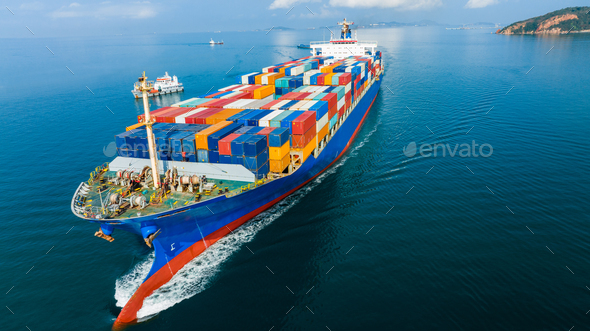 Aerial side view of cargo ship carrying container and running for export goods from cargo yard po