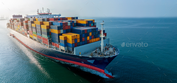 Aerial side view of cargo ship carrying container and running for export goods from cargo