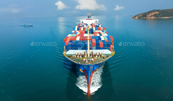 Aerial in front of cargo ship carrying container and running for export goods from cargo yard p