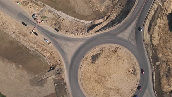 4k Top down aerial view of a traffic roundabout. Road construction
