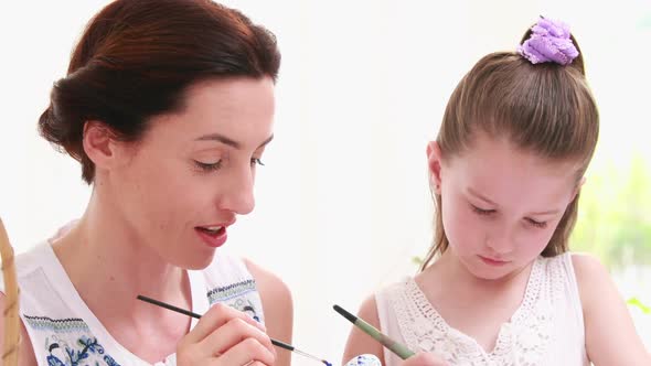 Mother and Daughter Painting Easter Eggs alt