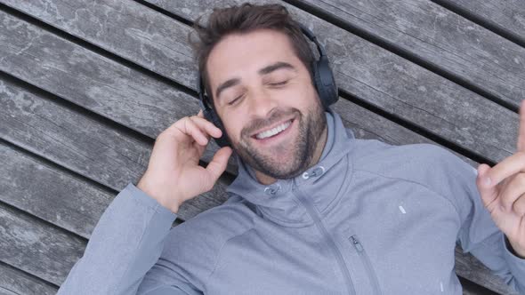 Handsome Guy Enjoying Music On Headphones