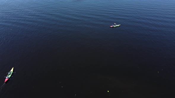 Aerial View From a Drone of a Person Who is Kayaking alt
