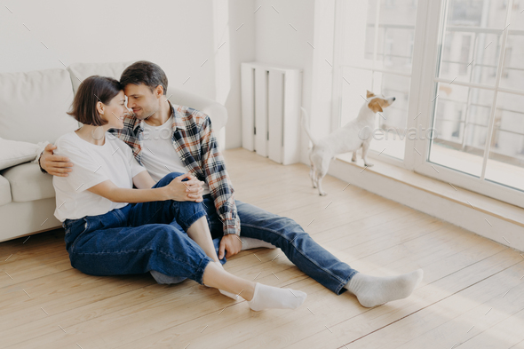 Happy newlywed couple move in new apartment, rejoice having spare time togethe