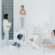 Photo of husband and wife, their dog and daughter do housework in laundry room - PhotoDune Item for Sale