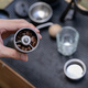 The barista slowbar holds a hand-cranked grinder with coffee beans inside. - PhotoDune Item for Sale